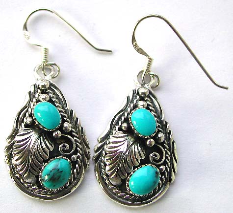 Fashion accessories - leaf pattern earring holding blue turquoise