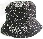 Double sided cotton bucket hat, one side of blak with white pattern decor fashion, and flipped over for plain black with zipper design