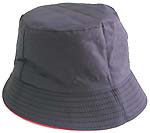 Fashion cotton double sided bucket hat, one side of neutral black, and flipped over for bright red with zipper design