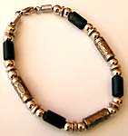 fashion bracelet with Bali silver beads and black wooden beades connected