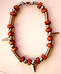 Bali silver strip and red wooden beads forming fashion bracelet with 3 spikes pattern ponited out