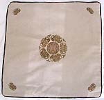 Neutral color with golden Celtic circluar symbol at center and 4 tiny pattern at each corner