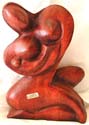 naked woman holding baby abstract carving stand