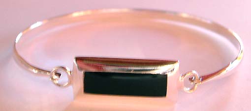 Sterling silver bangle with a black onyx stone inlay retangular pattern design in middle