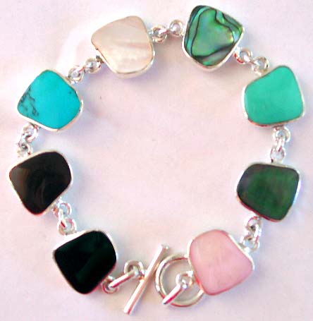 Assorted genuine stone embedded irregular shape pattern forming sterling silver bracelet, toggle clasp to close
