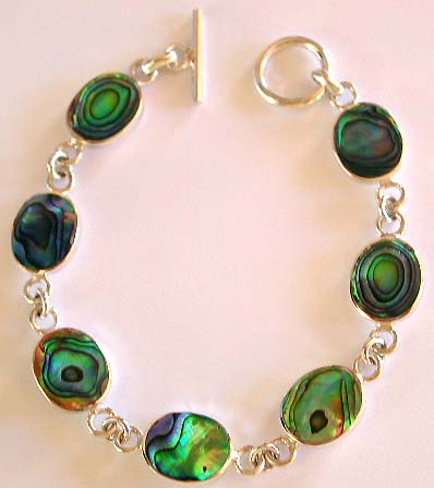 Multi oval shape abalone seashell forming sterling silver bracelet, toggle clasp to close
