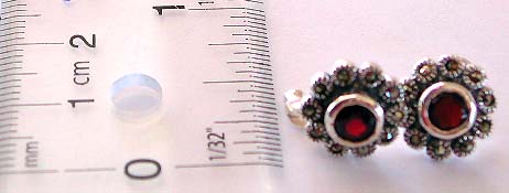 Multi mini marcasites stone forming flower pattern design sterling silver earring with a rounded garnet stone embedded in middle