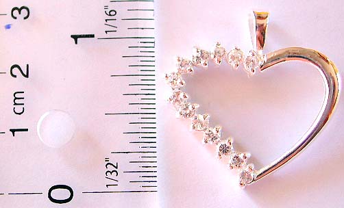 Cut-out heart shape pattern sterling silver pendant with multi mini clear cz embedded on on side