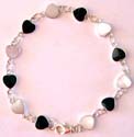 Multi white mother of pearl seashell / black onyx stone embedded heart shape pattern forming sterling silver bracelet