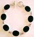Multi oval shape black onyx stone forming sterling silver bracelet, toggle clasp to close