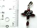 Olive shape red garnet stone forming cross pattern sterling silver pendant