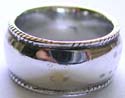 wide band sterling silver ring with line pattern decor around edge