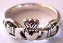Sterling silver ring with carved-out hand-holding-heart pattern design in middle