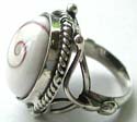 Rounded white seashell with spiral pattern inlaid sterling silver ring with cut-out pattern on both sides