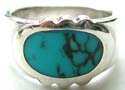 Sterling silver ring with horizontally laid oval shape blue turquoise stone embedded in middle