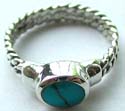 Twisted pattern design sterling silver ring with horizontally laid oval shape turquoise stone embedded in middle