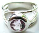 Carved-out 3 strips pattern design sterling silver ring holding a rounded light purple cz stone at center