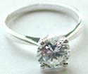 Elegant design sterling silver ring with a rounded clear cz set in middle