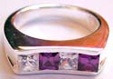 Sterling silver ring with 2 square purple and 2 clear cz stone embedded at center
