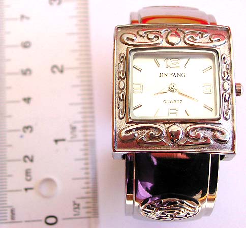 fashion bangle watch with elegant silver color sqaure shape and pattern decor around clock face and bangle
