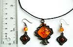 Cotton black rounded cord fashion necklace and earring set with imitation amber