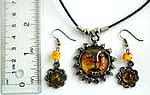 Cotton black rounded cord fashion necklace and earring set with sun face pattern imitation amber pendant