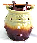 Oriental double pot style ceramic oil burner with a wooden stick