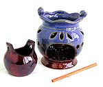 Ceramic flower pot oil burner with carved out pattern and a wooden stick