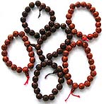 Strecthy, assorted color and design resin beaded fashion bracelet with traditional religious sign painted on each bead ( it is believed that wearing one of such bracelet can protect you from evil spirit and bad luck)