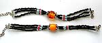 Black beaded three strings forming fashion bracelet with imitation amber