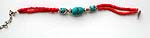 Red beaded double strings forming fashion bracelet with imitation turquoise at center