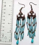 Fashion earring with metal bat shape pattern holding multi blue and black beaded dangle
