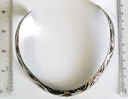 Women's Fashion Necklaces. Silver cuff necklace with carved-in wavy line pattern decor