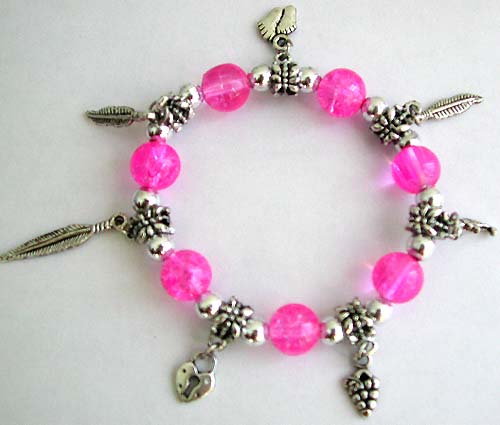 Supplier of charm bracelet distribute multi pinky round beads and silver beads forming stretchy fashion charm bracelet with assorted design figure, leaf, feet, dolphin and lock