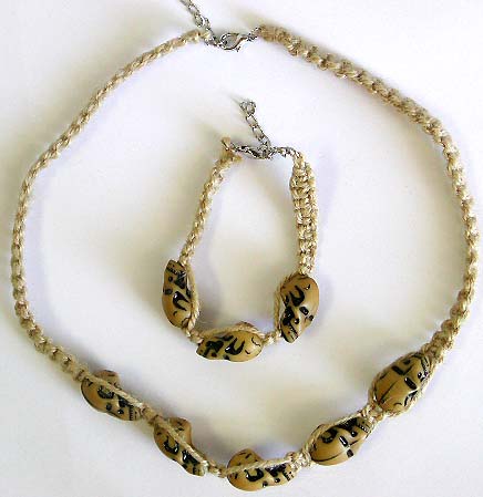 Fashion hemp string necklace and bracelet set with skulls pattern embedded in middle, bead loop to close