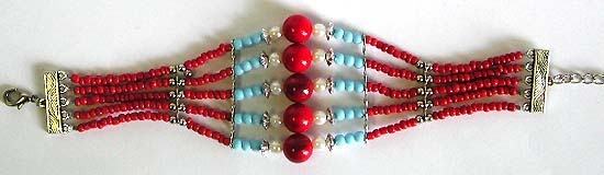 Ethnographic jewelry of Tibertan bracelet with imitation coral round beads and multiple strings of seedbeads