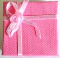 Pink square ring box with butterfly tie knot decor 