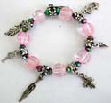 Pink jewelry, pinky charm bracelet with assorted design figure, leaf, cross, triangle, key and dollar sign charms dangling