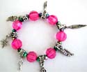 Dark pink color facet beads and silver beaded fashion charm strecthcy bracelet with assorted design figure, leaf, cross, triangle, key and dollar sign