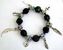 Multi black facet beads and silver beaded fashion charm strecthcy bracelet with assorted design figure, leaf, lock, and moon
