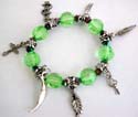 Charm bracelet wholesale online offer  Light green facet beads and silver beaded fashion charm strecthcy bracelet with assorted design figure, leaf, cross, key, dollar sign and moon