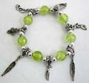 Green round beads and silver beads forming strecthcy fashion charm bracelet with assorted design figure, leaf, cross and butterfly 