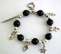 Multi black round beads and silver beads forming strecthcy fashion charm bracelet with assorted design figure, leaf, cross, key heart and star