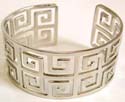 Carved-out puzzle pattern forming fashion bangle bracelet