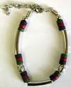 Industrial fashion bracelet with linked metal, red and green bead 