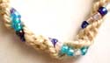 Multi light and dark blue beads twisted with hemp string forming fashion necklace and bracelet set, bead and double loop to close