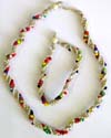 Assorted color beads twisted with hemp string forming fashion necklace and bracelet set, bead and double loop to close