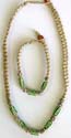 Fashion necklace and bracelet set with green beads embedded in middle, bead and double loop to close