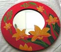 Rounded red wooden mirror with yellow lily flower decor