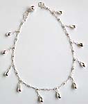 Tear-drop pattern sterling silver anklet with a mini bell attached at the end